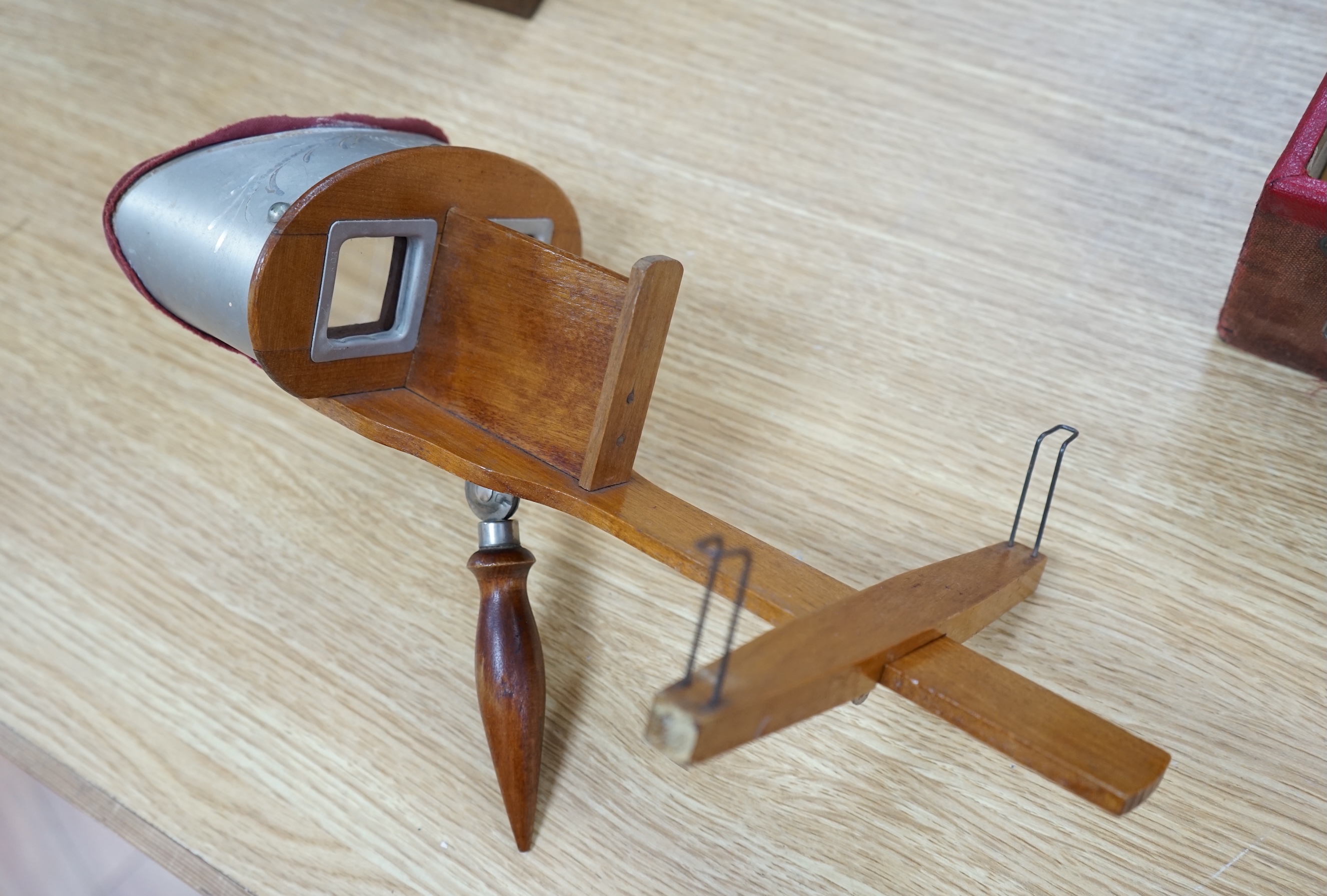 An R.K. White Co. stereoscopic viewer and a collection of slides, viewer 33cm long. Condition - cards have been damp at some point